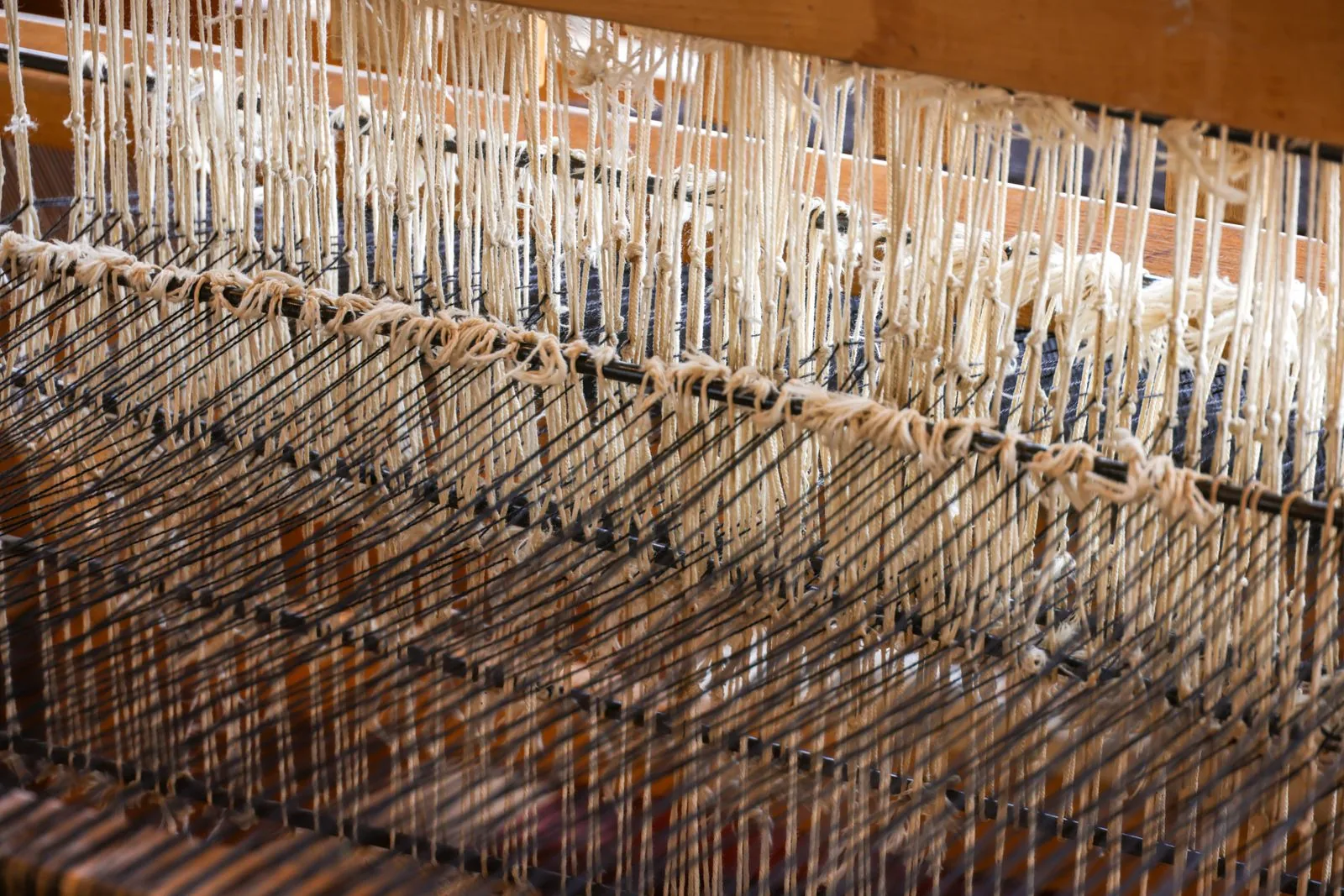 Hand-knotting the slow way — the craft behind every good Tibetan carpet.